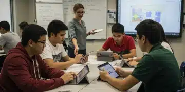 High school students collaborating on a project in a modern classroom, preparing for college readiness.