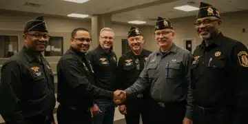 Veterans smiling at a modern support center, representing new healthcare and housing benefits.