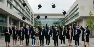 Graduates celebrating on a modern university campus in 2026, symbolizing academic achievement and future prospects.