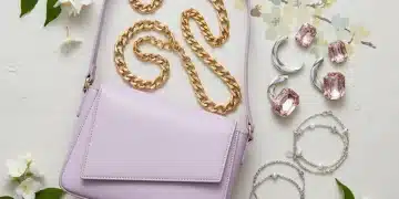 Stylish flat lay of spring 2026 accessory trends including pastel bags and layered jewelry