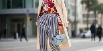 Pattern Play: How to Confidently Mix Prints in Your 2026 Outfits with 3 Easy Rules Stylish woman mixing floral blouse with striped trousers confidently